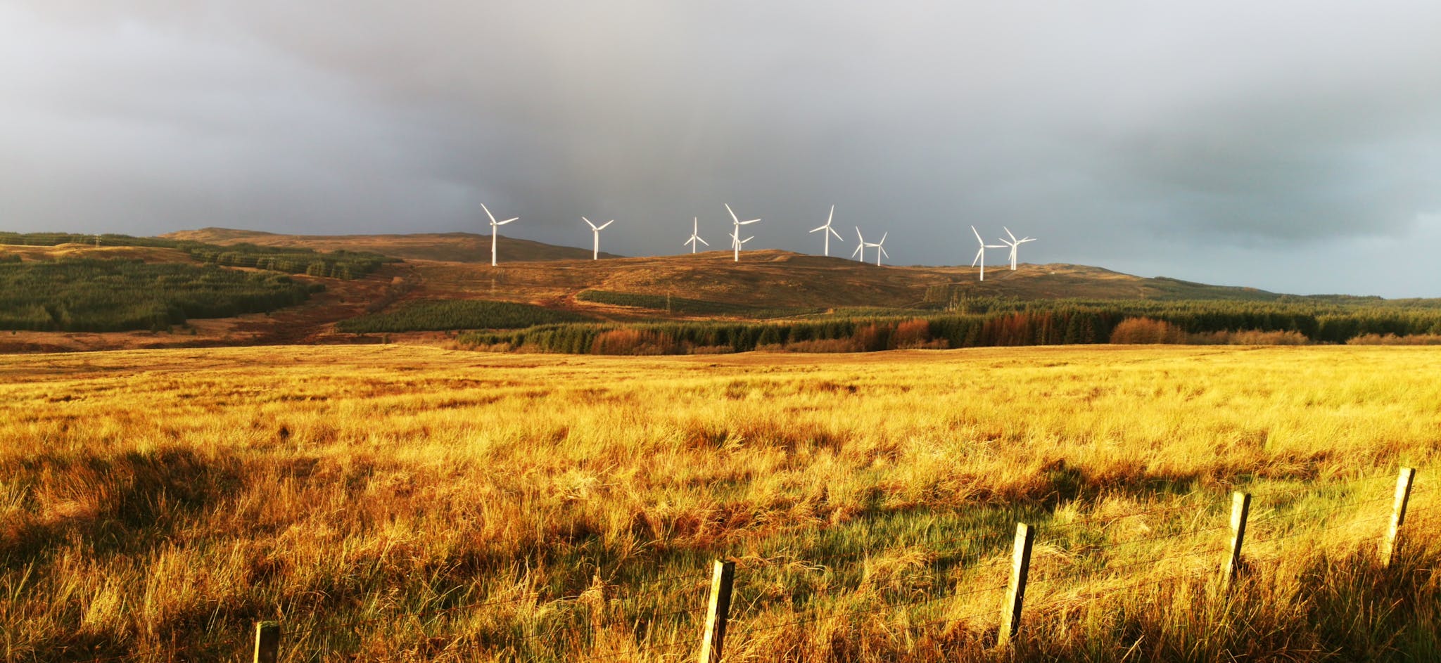 About 8 wind turbines in claonaig scotland showcasing renewable